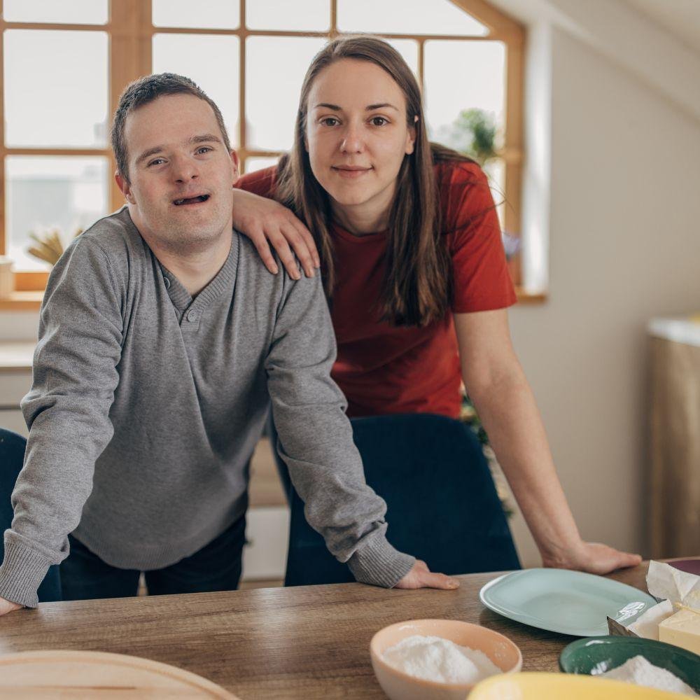 Man and woman at a kitchen bench, representing disability support in Perth - About Mindul pathways support page