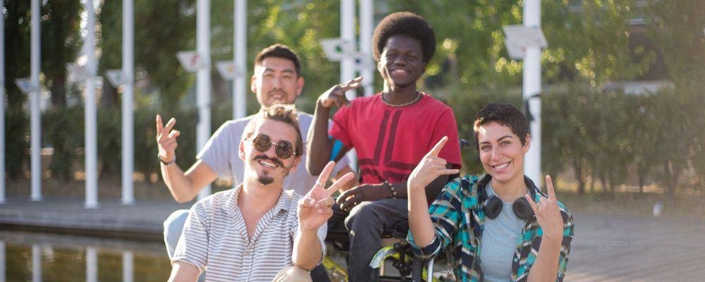 NDIS service areas Perth – group of people, including a wheelchair user, spending time together outdoors.
